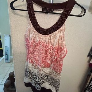 Sleeveless top with beaded neckline